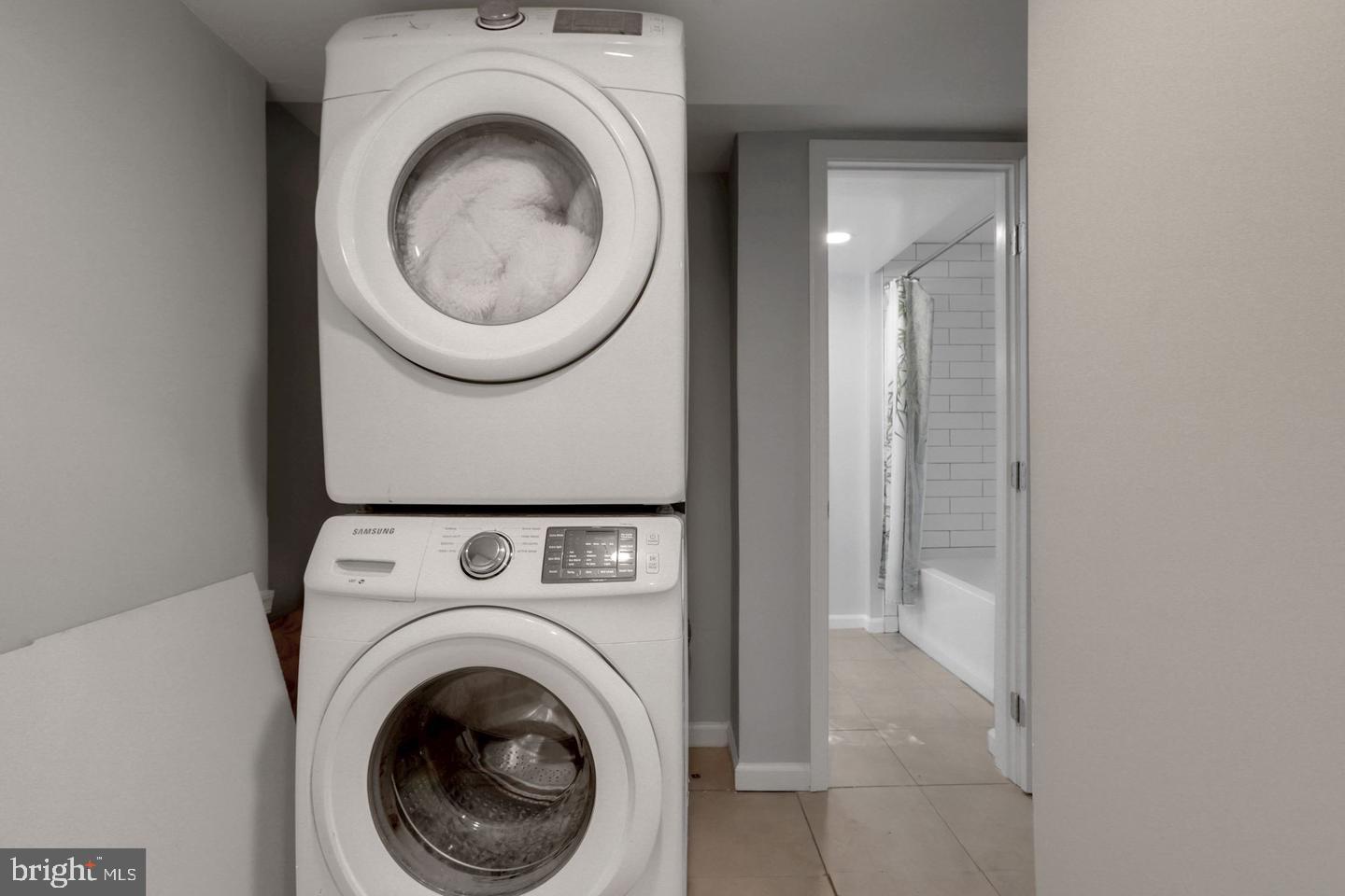 5504 Keppler Road Temple Hills, MD 20748 - Photo 17 of 19 a view of a hallway with washer and dryer