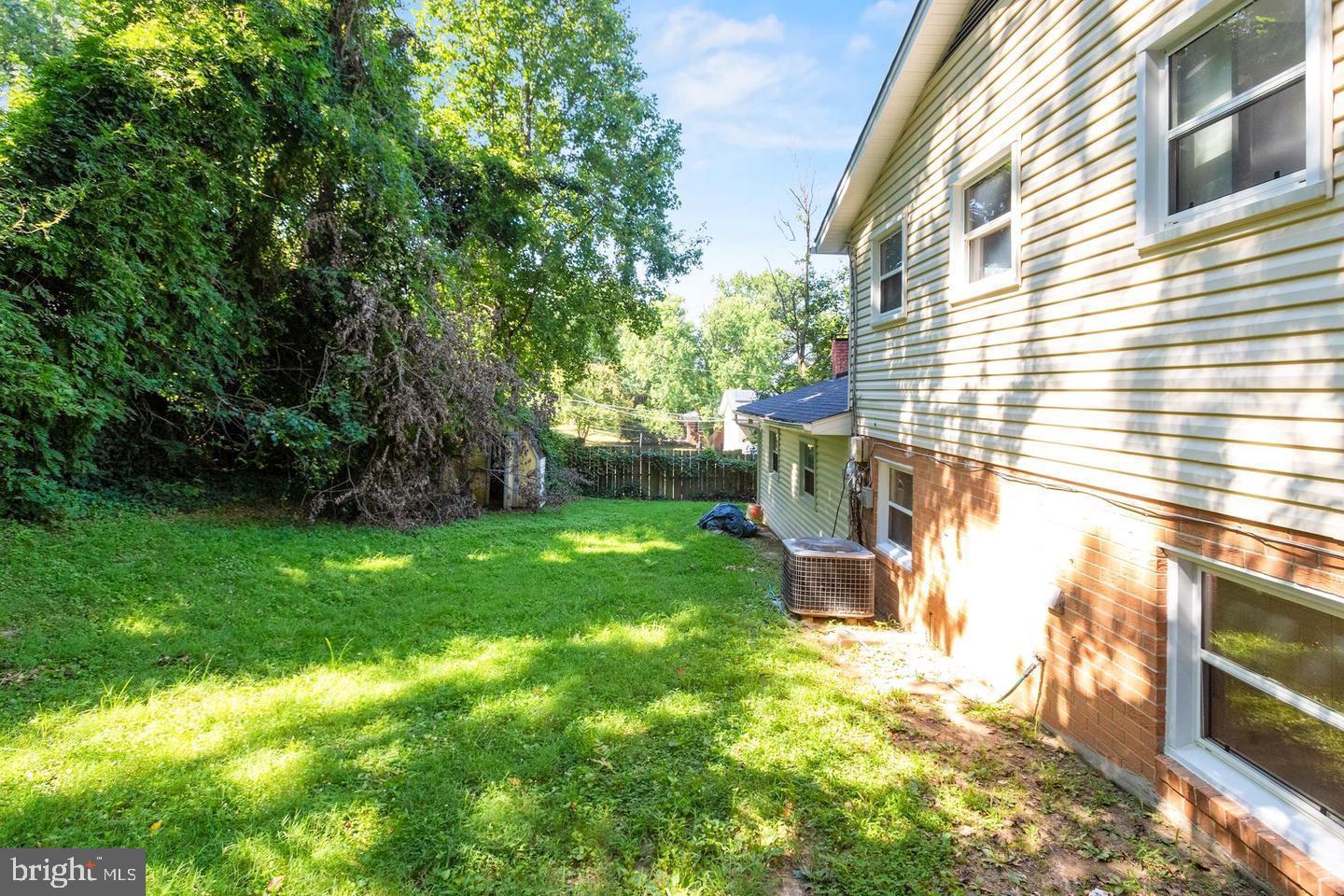 5504 Keppler Road Temple Hills, MD 20748 - Photo 18 of 19 a backyard of a house with lots of green space