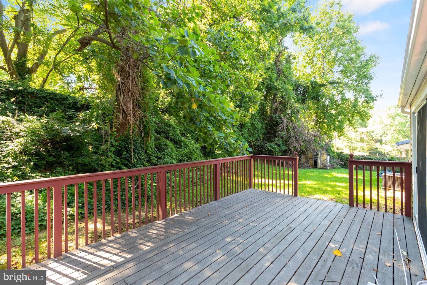 5504 Keppler Road Temple Hills, MD 20748 - Photo 19 of 19 a view of balcony with deck and trees