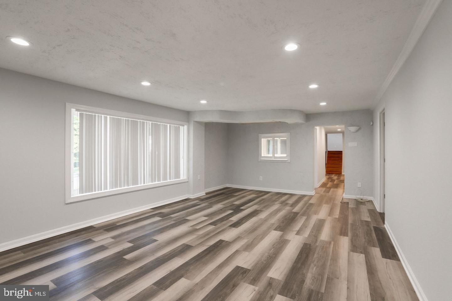5504 Keppler Road Temple Hills, MD 20748 - Photo 8 of 19 a view of empty room with wooden floor and fan