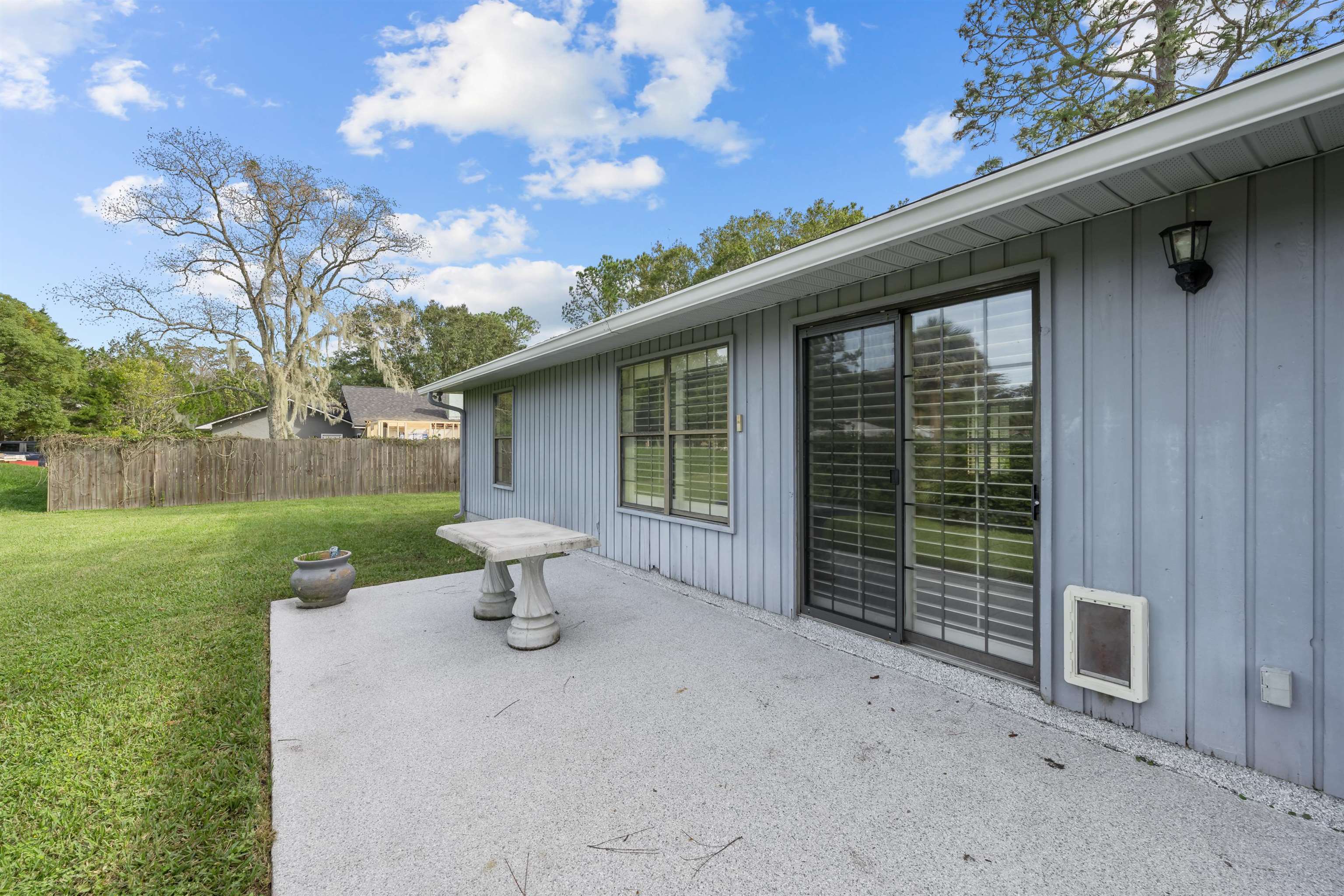240 Watson Road St. Augustine, FL 32086 - Photo 27 of 43 a view of a house with backyard and a garden
