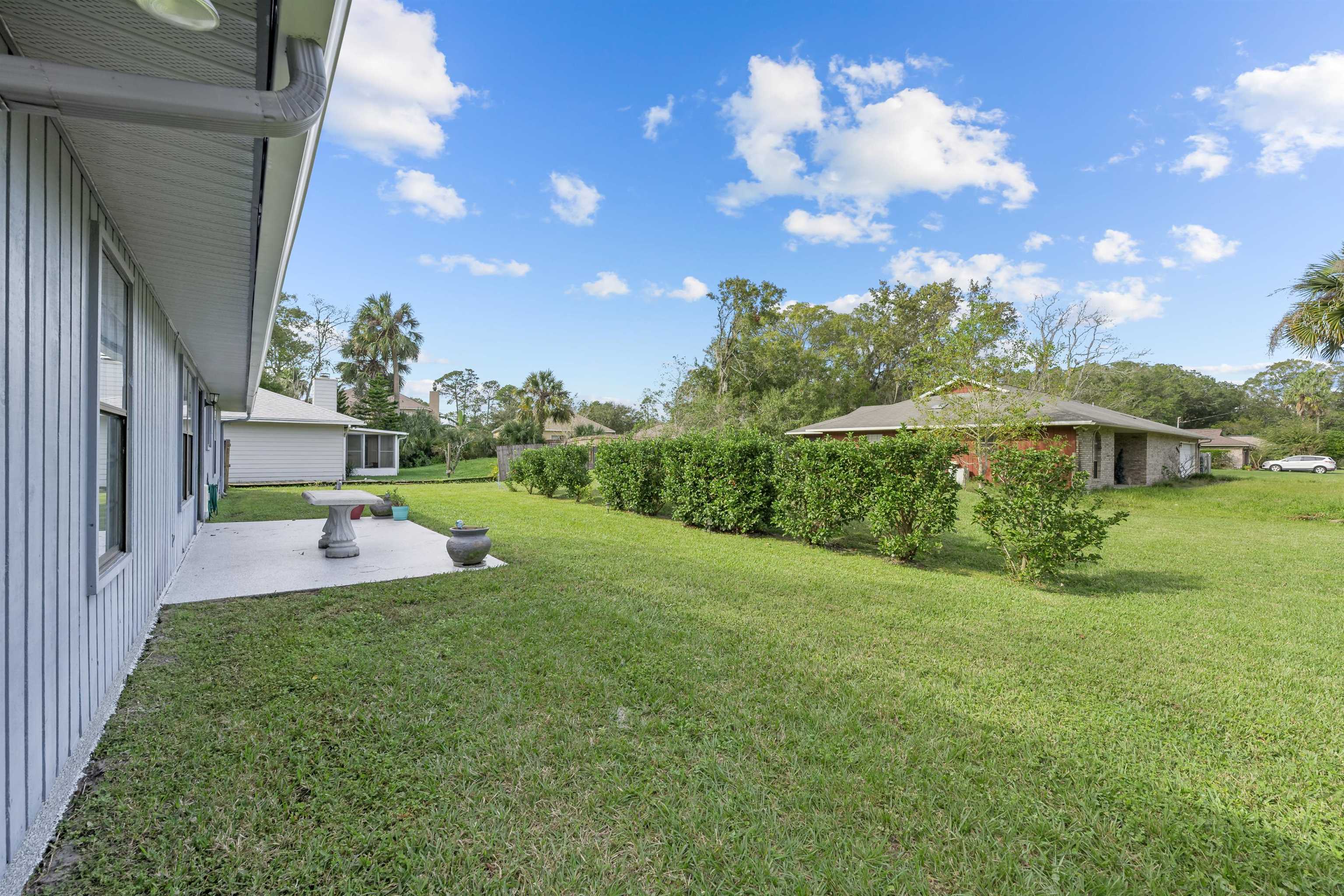 240 Watson Road St. Augustine, FL 32086 - Photo 28 of 43 a front view of a house with garden