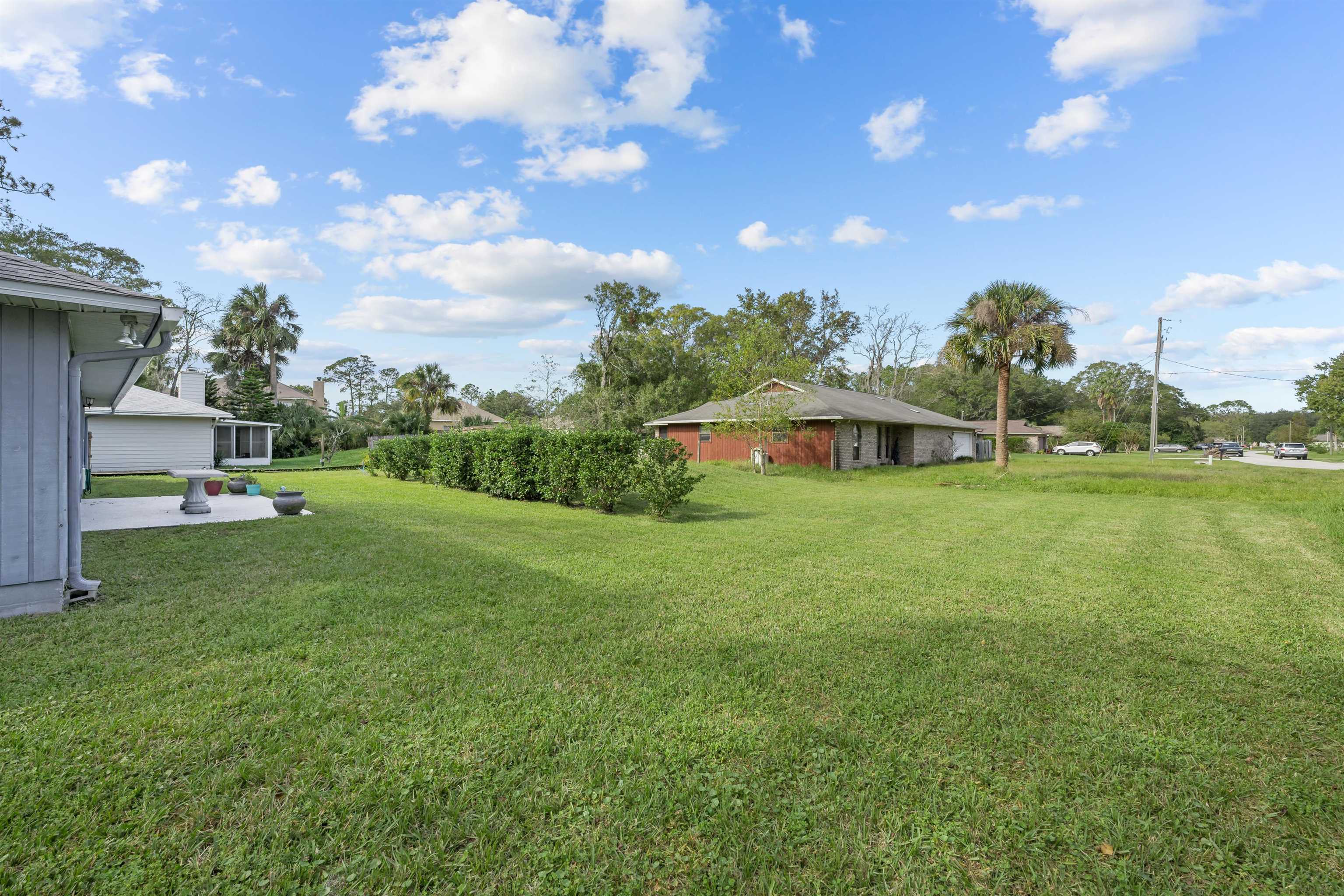 240 Watson Road St. Augustine, FL 32086 - Photo 30 of 43 a view of a house with a backyard