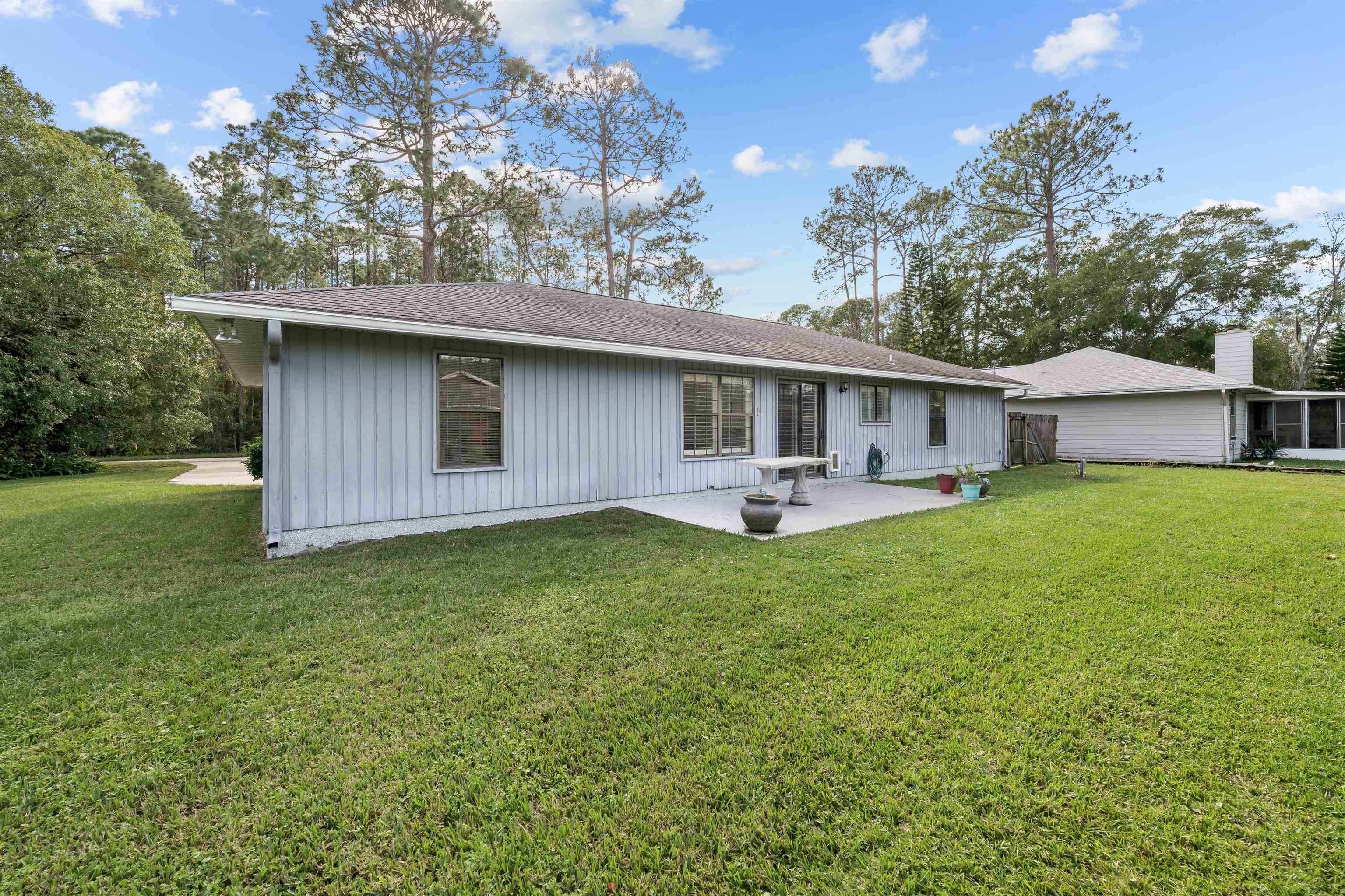240 Watson Road St. Augustine, FL 32086 - Photo 31 of 43 a front view of house with yard and green space