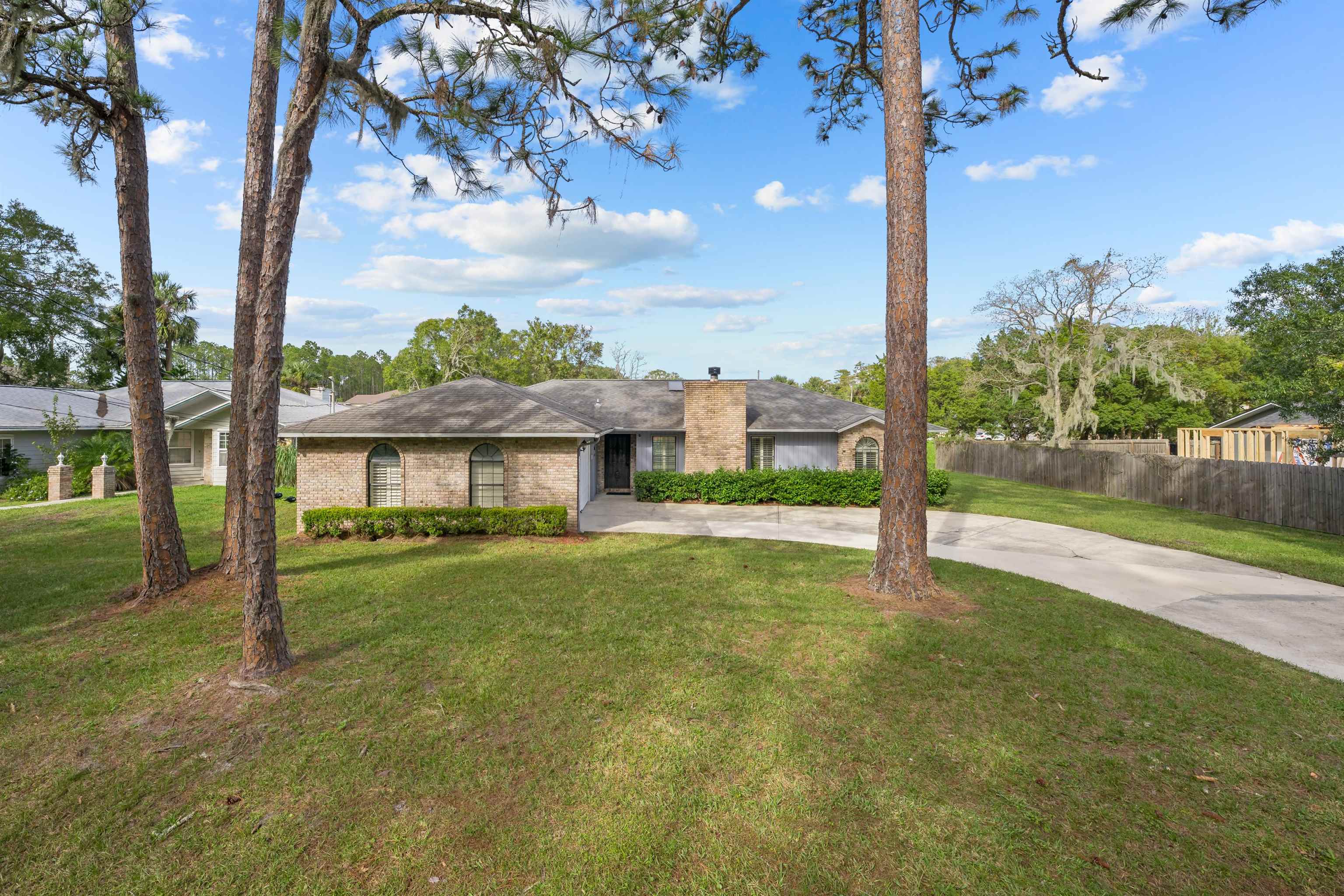 240 Watson Road St. Augustine, FL 32086 - Photo 35 of 43 a view of a house with a yard and a tree