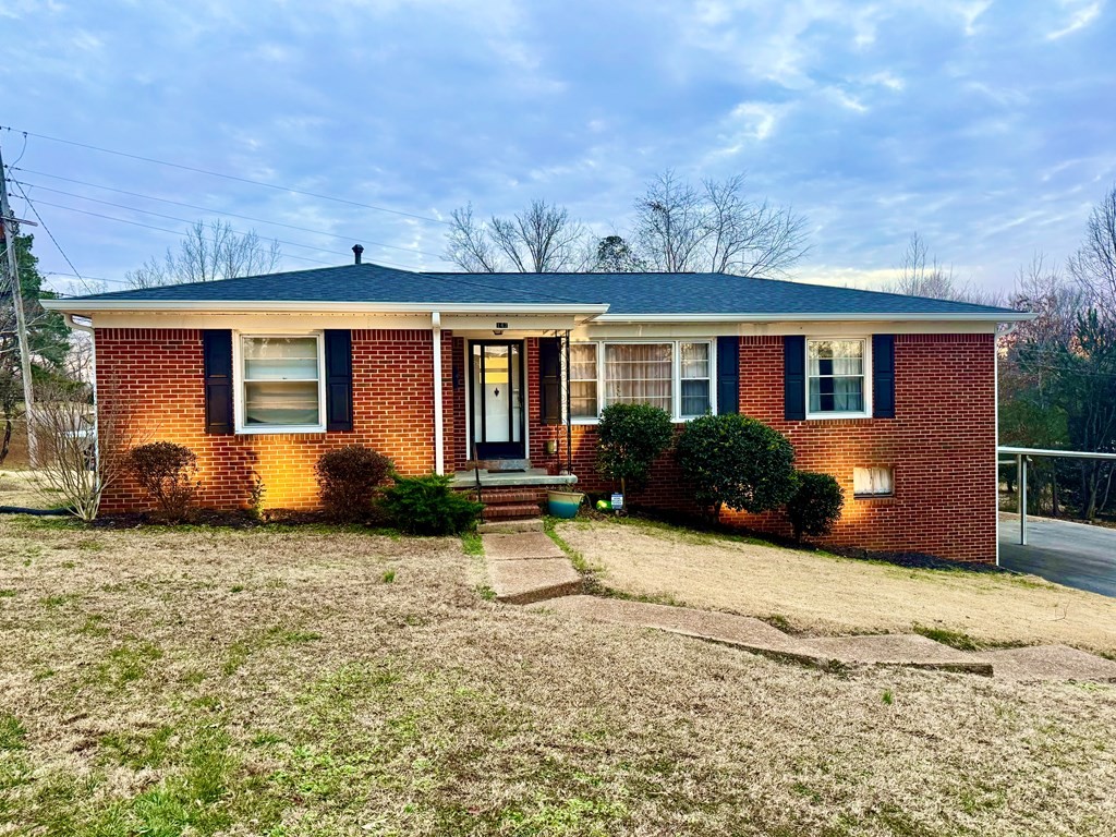 147 Berry Street Camden, TN 38320 - Photo 1 of 16 a view of a house with backyard and sitting area