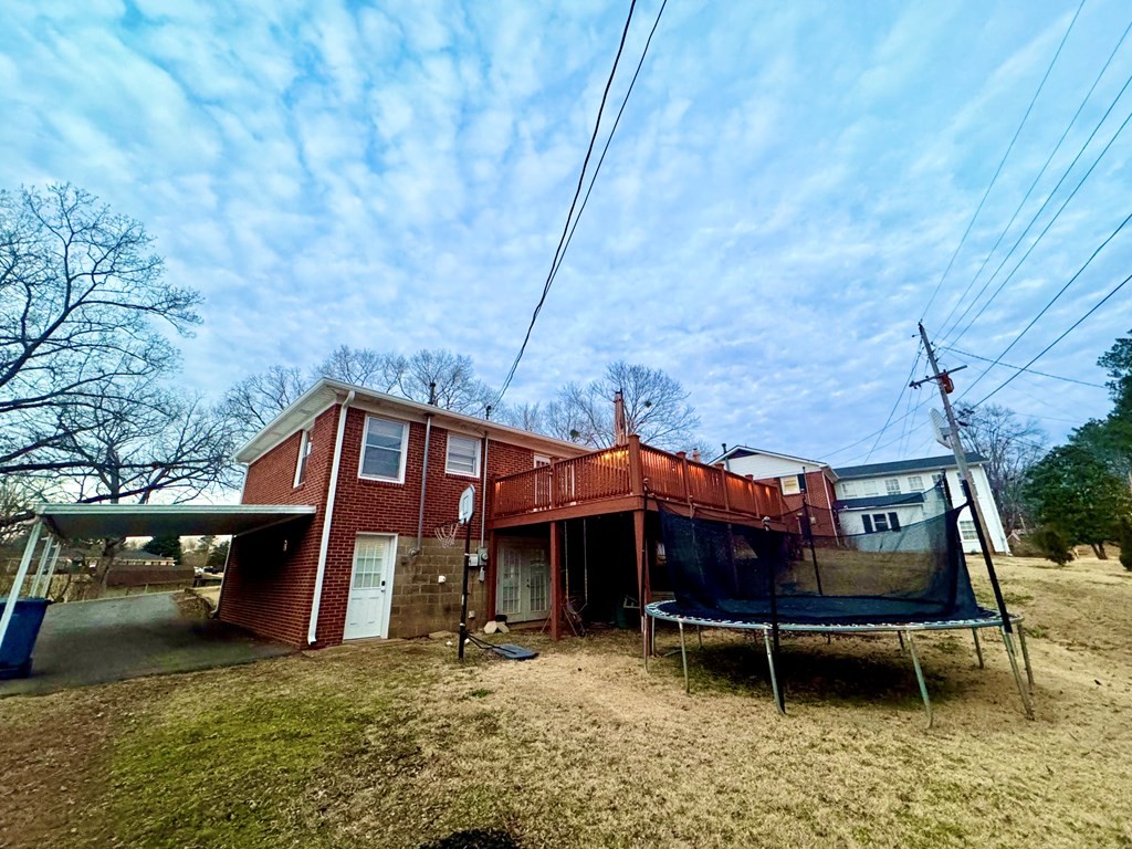 147 Berry Street Camden, TN 38320 - Photo 15 of 16 a view of house with a yard tub and seating space