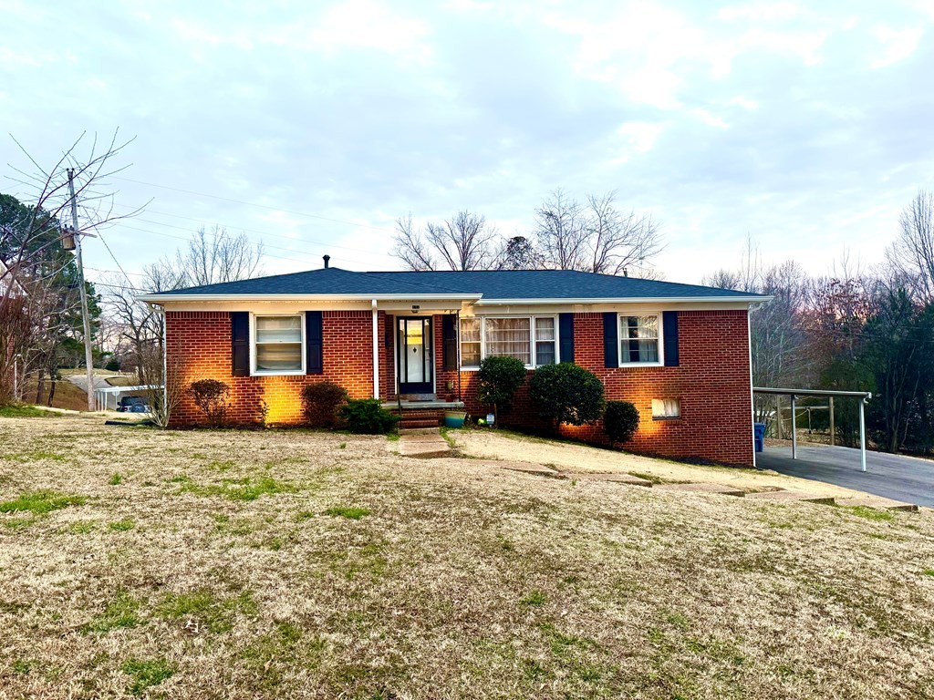 147 Berry Street Camden, TN 38320 - Photo 2 of 16 front view of a house with a yard