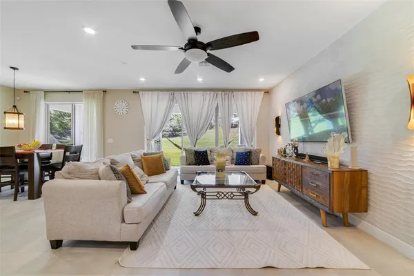 a living room with furniture and a large window