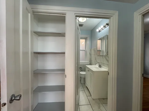 a bathroom with a shower and a sink
