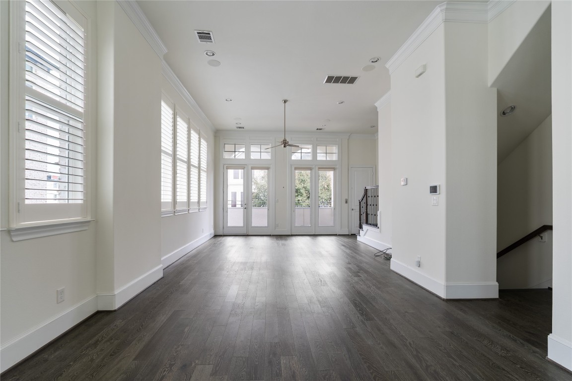 2613 Maxroy Street Houston, TX 77007 - Photo 11 of 42 The kitchen flows seamlessly into the living area, maintaining connection while preserving defined spaces.