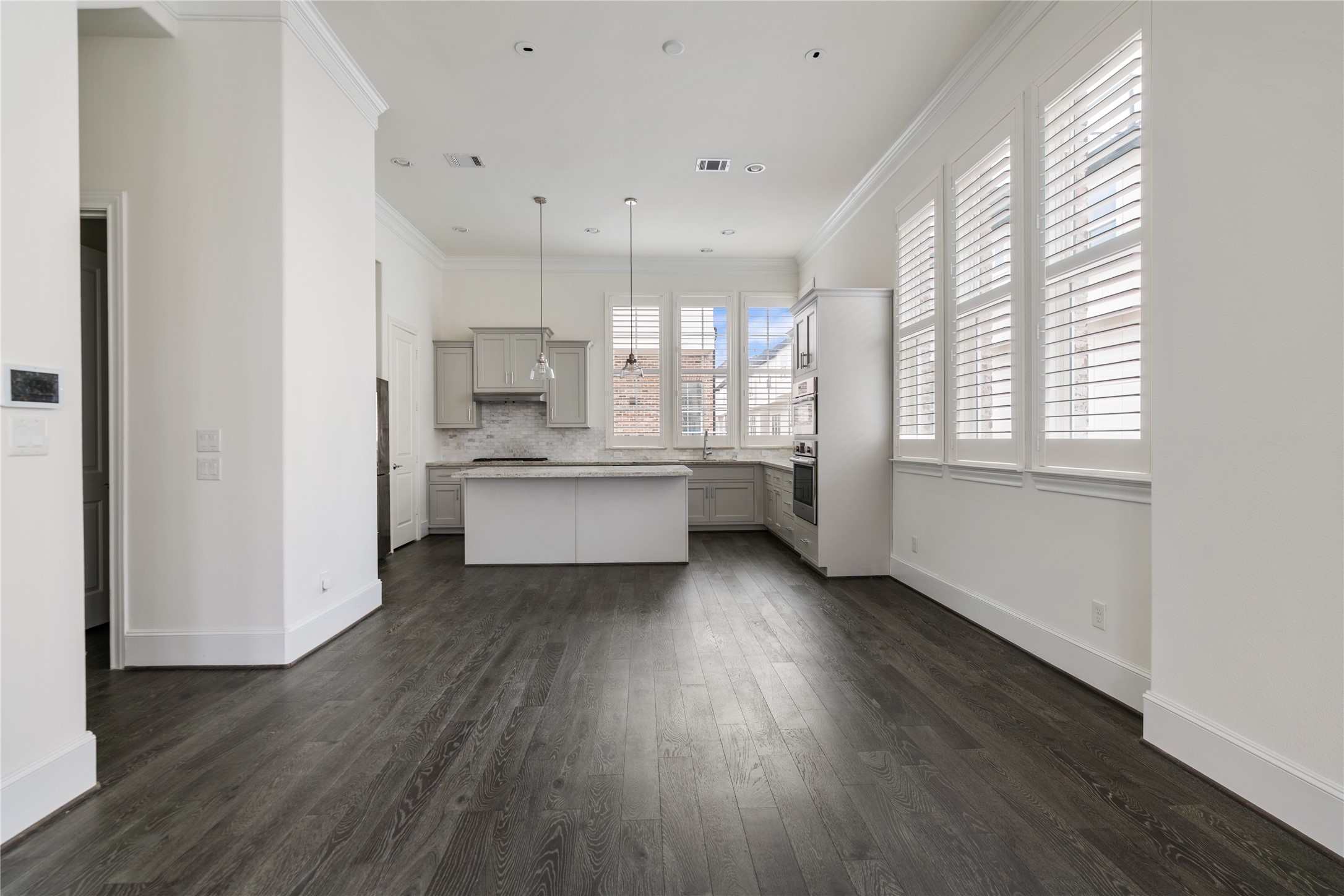 2613 Maxroy Street Houston, TX 77007 - Photo 13 of 42 Positioned beneath elevated ceilings and surrounded by natural light, the dining space offers flexibility for a variety of table sizes and layouts.