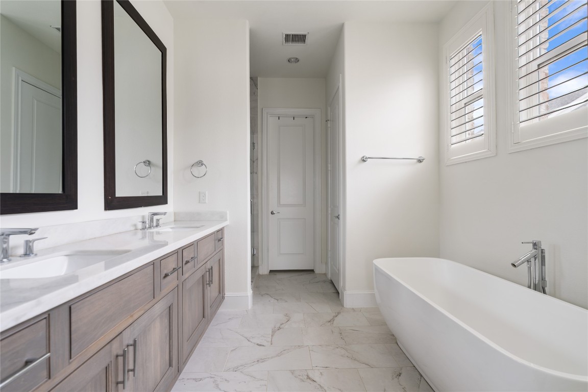 2613 Maxroy Street Houston, TX 77007 - Photo 22 of 42 Dual sinks, expansive counter space, ample storage, and a functional layout all contribute to daily ease.