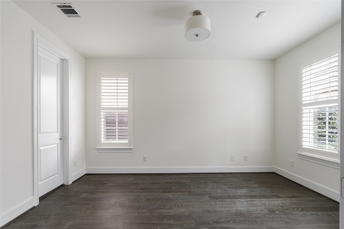 2613 Maxroy Street Houston, TX 77007 - Photo 35 of 42 The spacious ground floor bedroom, tucked away behind French doors, offers privacy & comfort & is perfect for hosting guests or for a quiet home office.