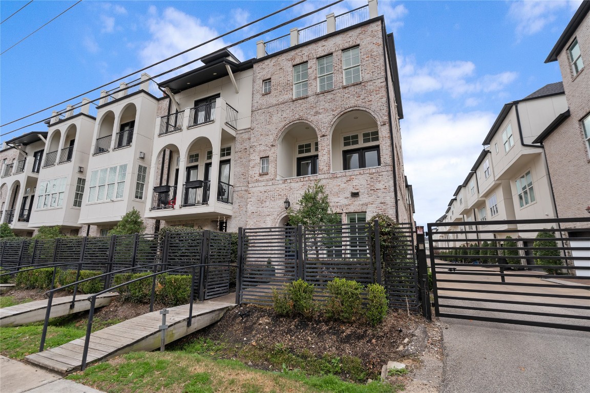 2613 Maxroy Street Houston, TX 77007 - Photo 42 of 42 The beautiful brick exterior combines classic architectural lines with a private entry and attached two-car garage for everyday convenience.