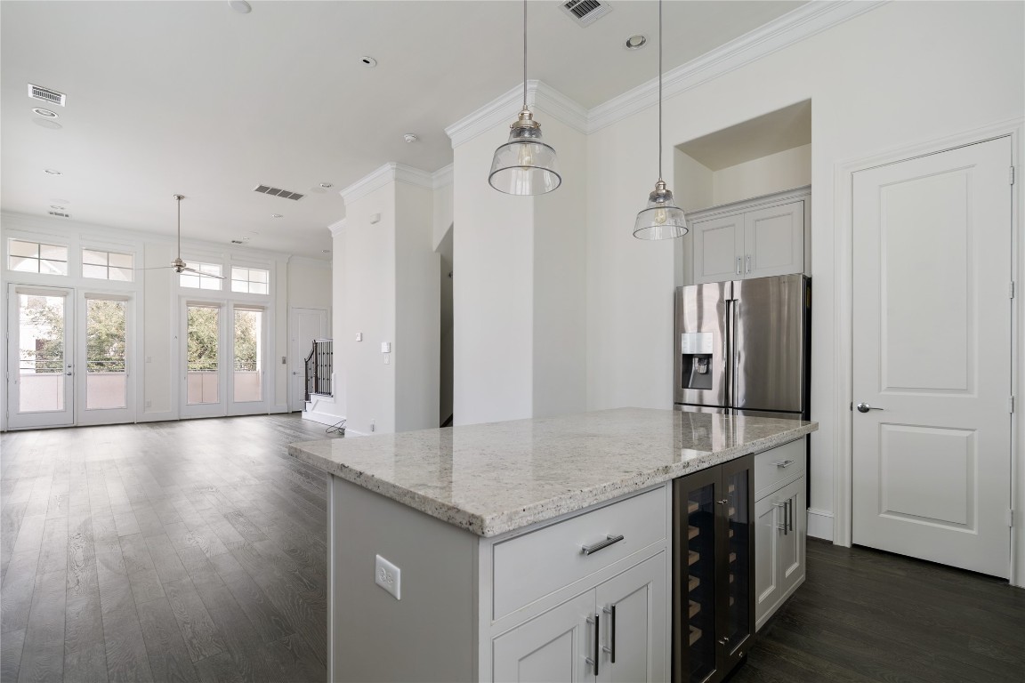 2613 Maxroy Street Houston, TX 77007 - Photo 10 of 42 The chef’s kitchen anchors the main living level with generous prep space, quality appliances, and an oversized island designed for gathering.