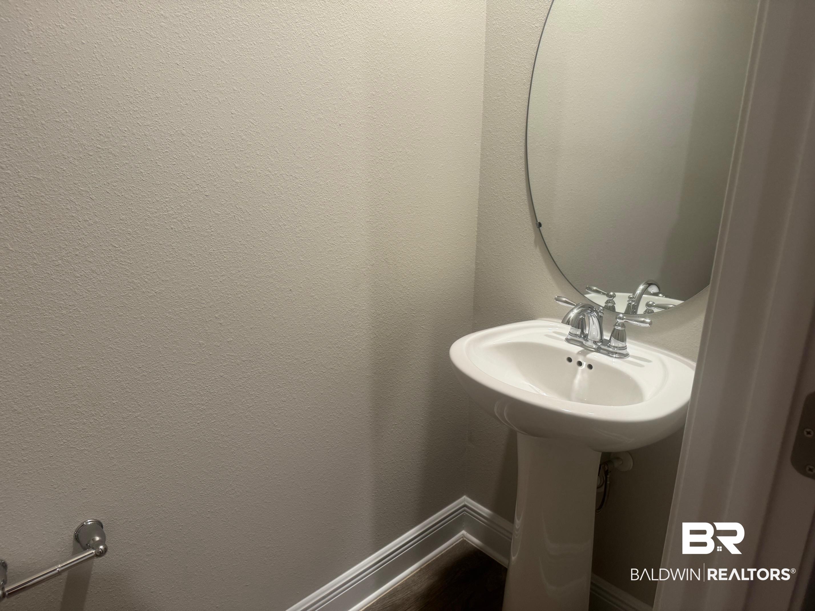 24903 Spectacular Bid Loop Daphne, AL 36526 - Photo 23 of 37 Bathroom with baseboards and a sink