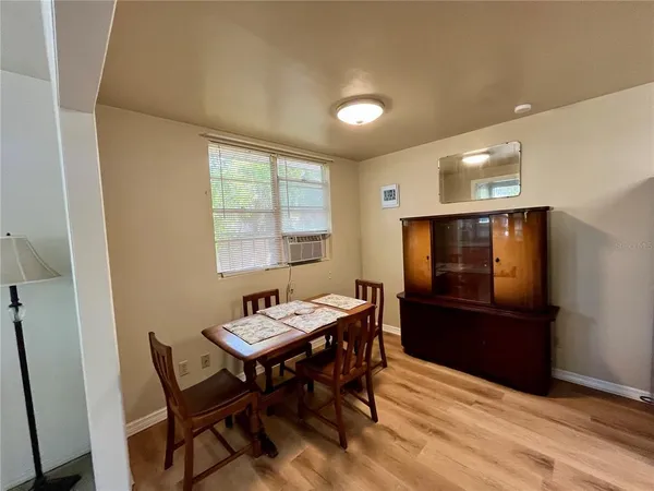 a view of a dining room with furniture and window