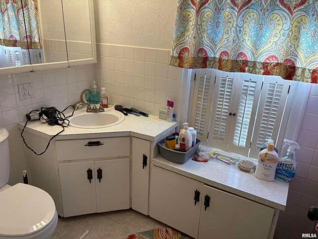 a view of a house with a tree