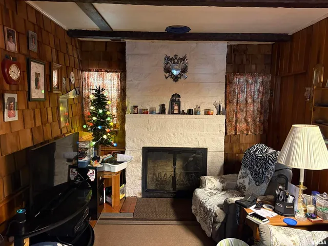 a living room with furniture and a fireplace