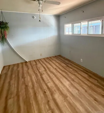 a view of a big room with windows