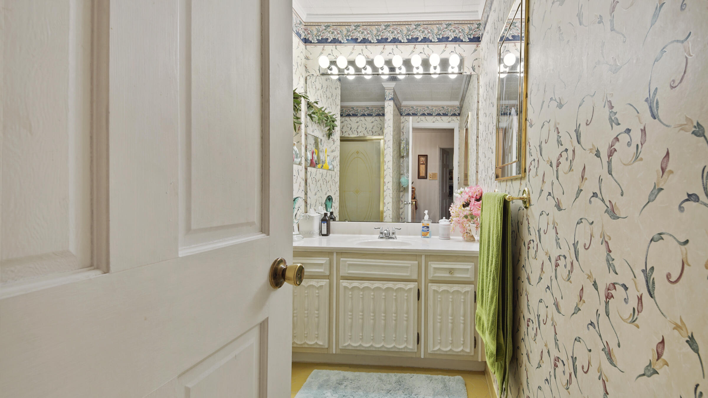 1124 Bay Grove Road Freeport, FL 32439 - Photo 12 of 37 a bathroom with a sink and a mirror
