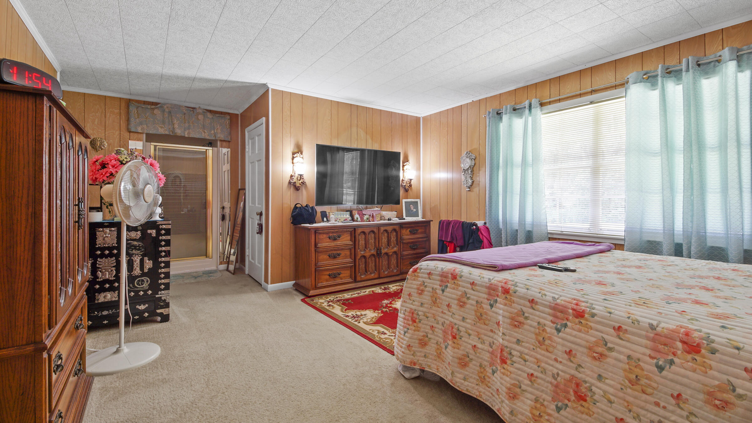 1124 Bay Grove Road Freeport, FL 32439 - Photo 14 of 37 a bed room with a bed and a television