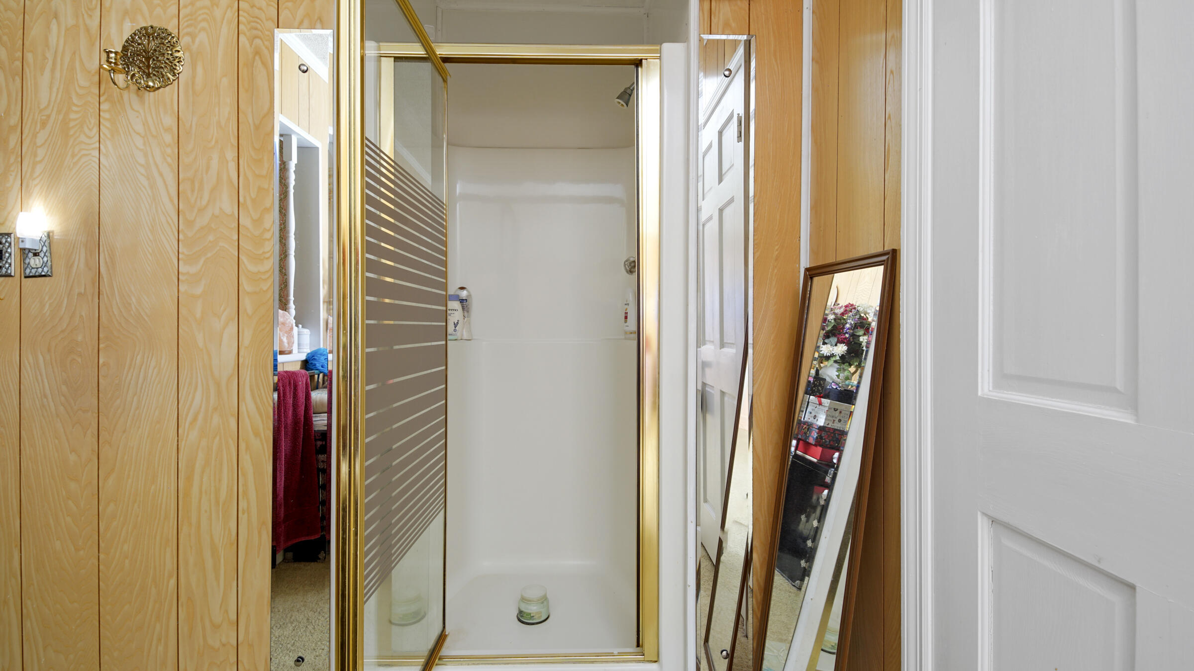 1124 Bay Grove Road Freeport, FL 32439 - Photo 16 of 37 a bathroom with a shower and a door