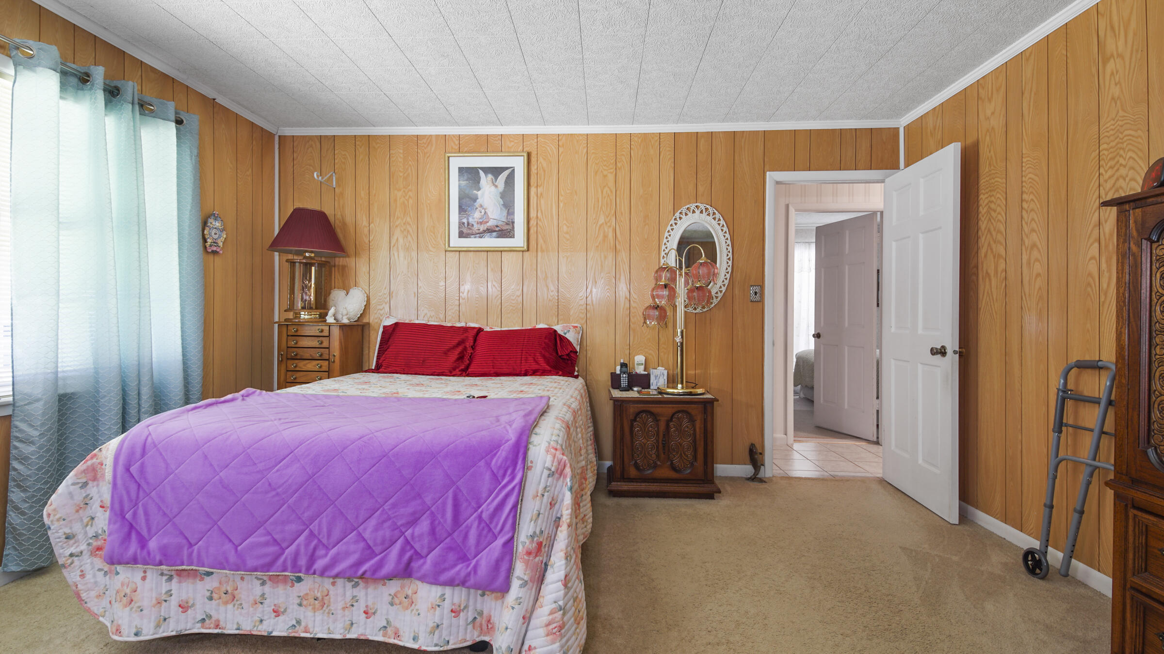 1124 Bay Grove Road Freeport, FL 32439 - Photo 17 of 37 a bedroom with a bed and a dresser