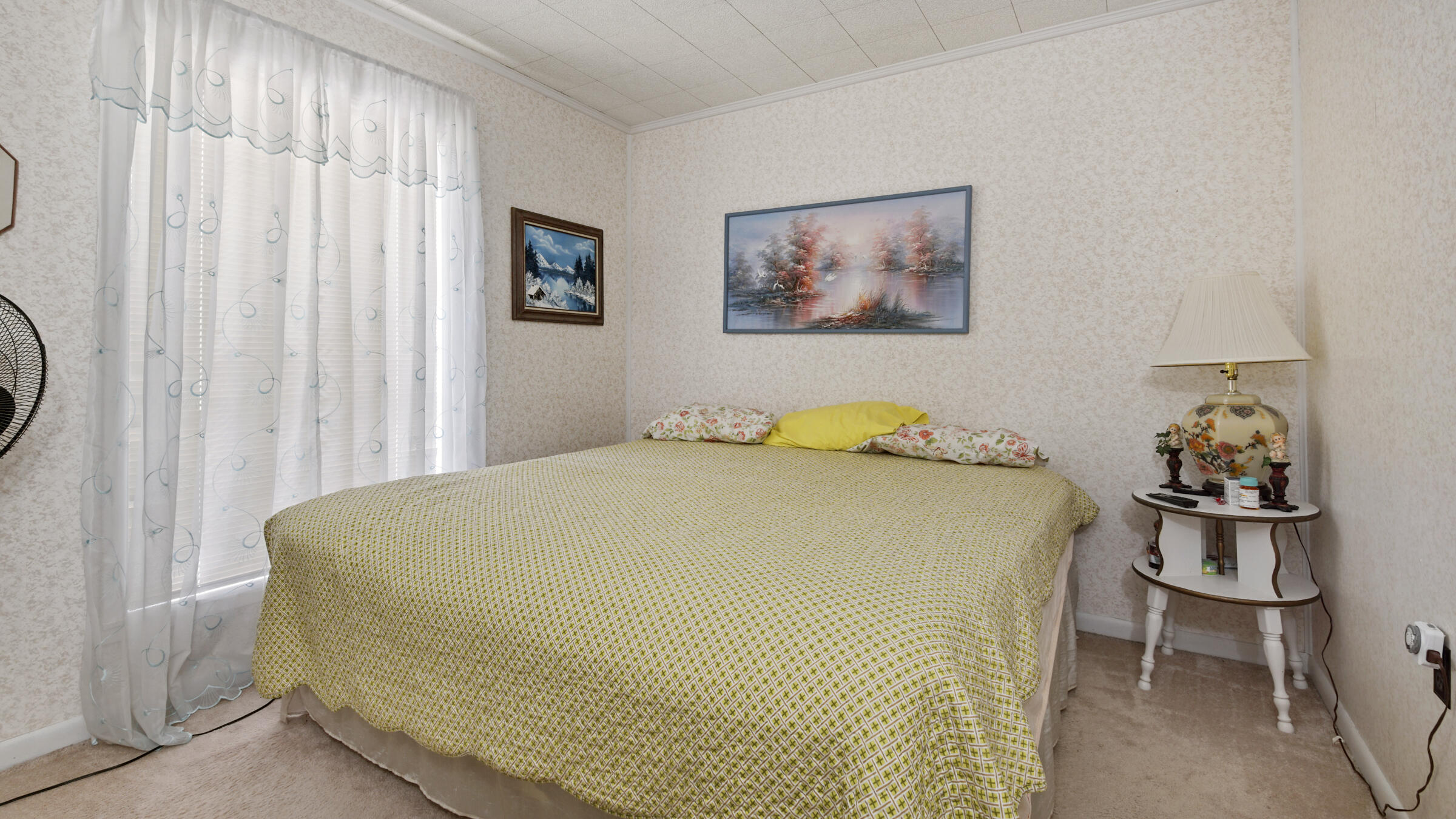 1124 Bay Grove Road Freeport, FL 32439 - Photo 19 of 37 a bedroom with a bed and painting on the wall