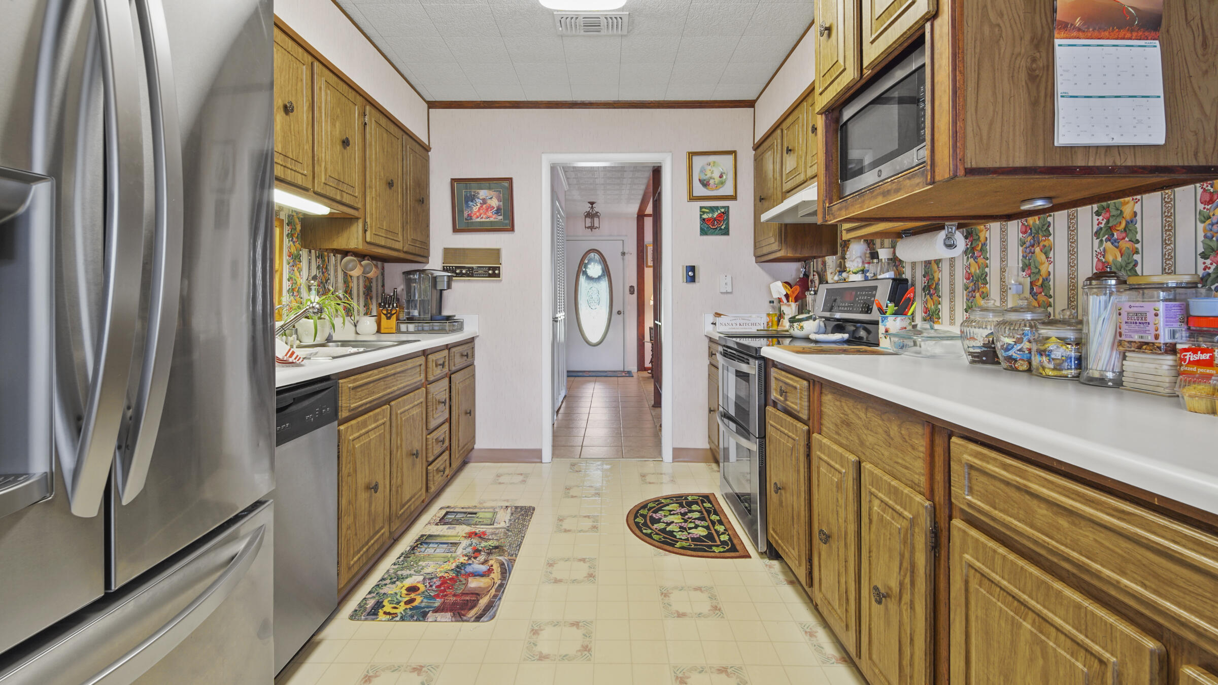 1124 Bay Grove Road Freeport, FL 32439 - Photo 21 of 37 a kitchen with stainless steel appliances granite countertop a refrigerator and a stove