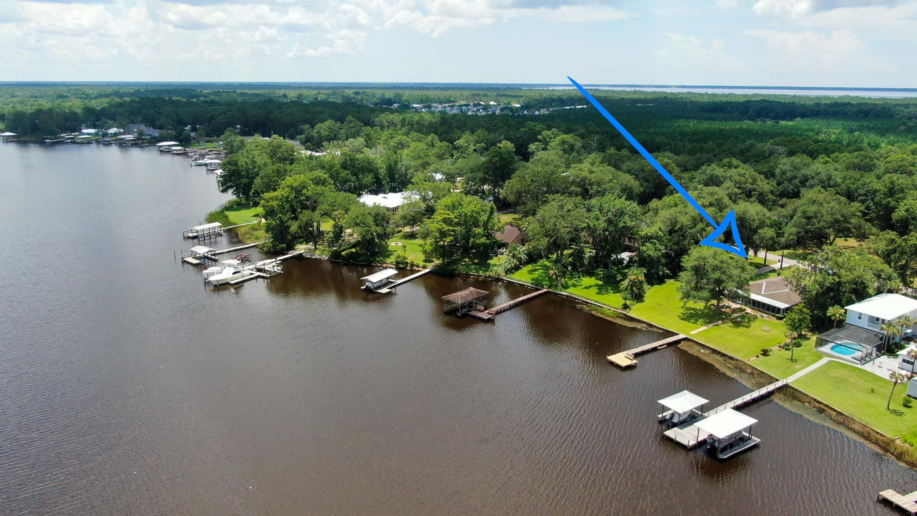 1124 Bay Grove Road Freeport, FL 32439 - Photo 34 of 37 an aerial view of a house with a lake view