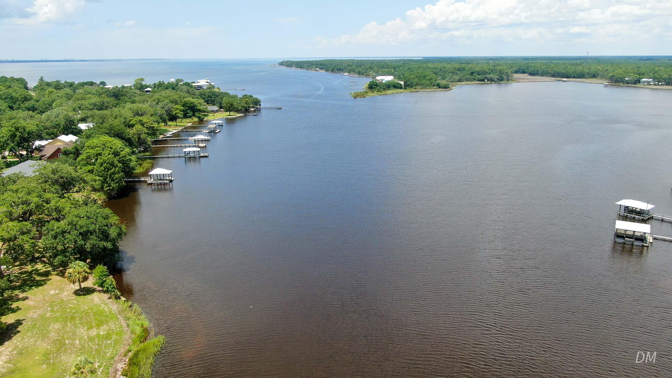 1124 Bay Grove Road Freeport, FL 32439 - Photo 35 of 37 a view of a lake with outside space