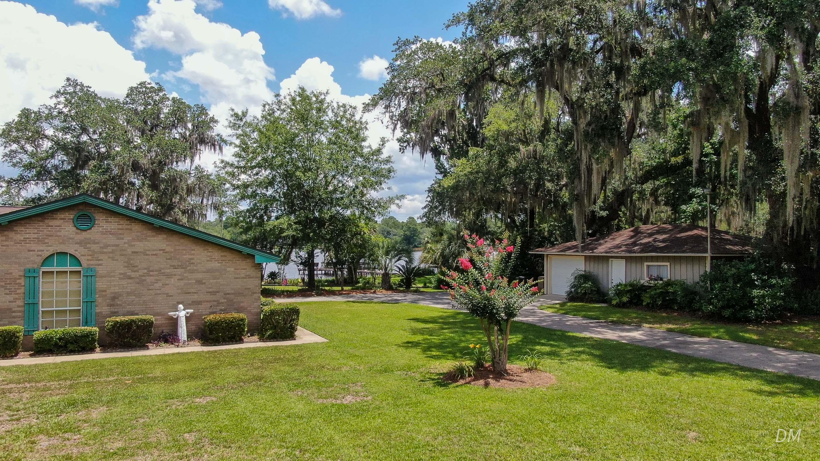 1124 Bay Grove Road Freeport, FL 32439 - Photo 36 of 37 a view of a house with a yard