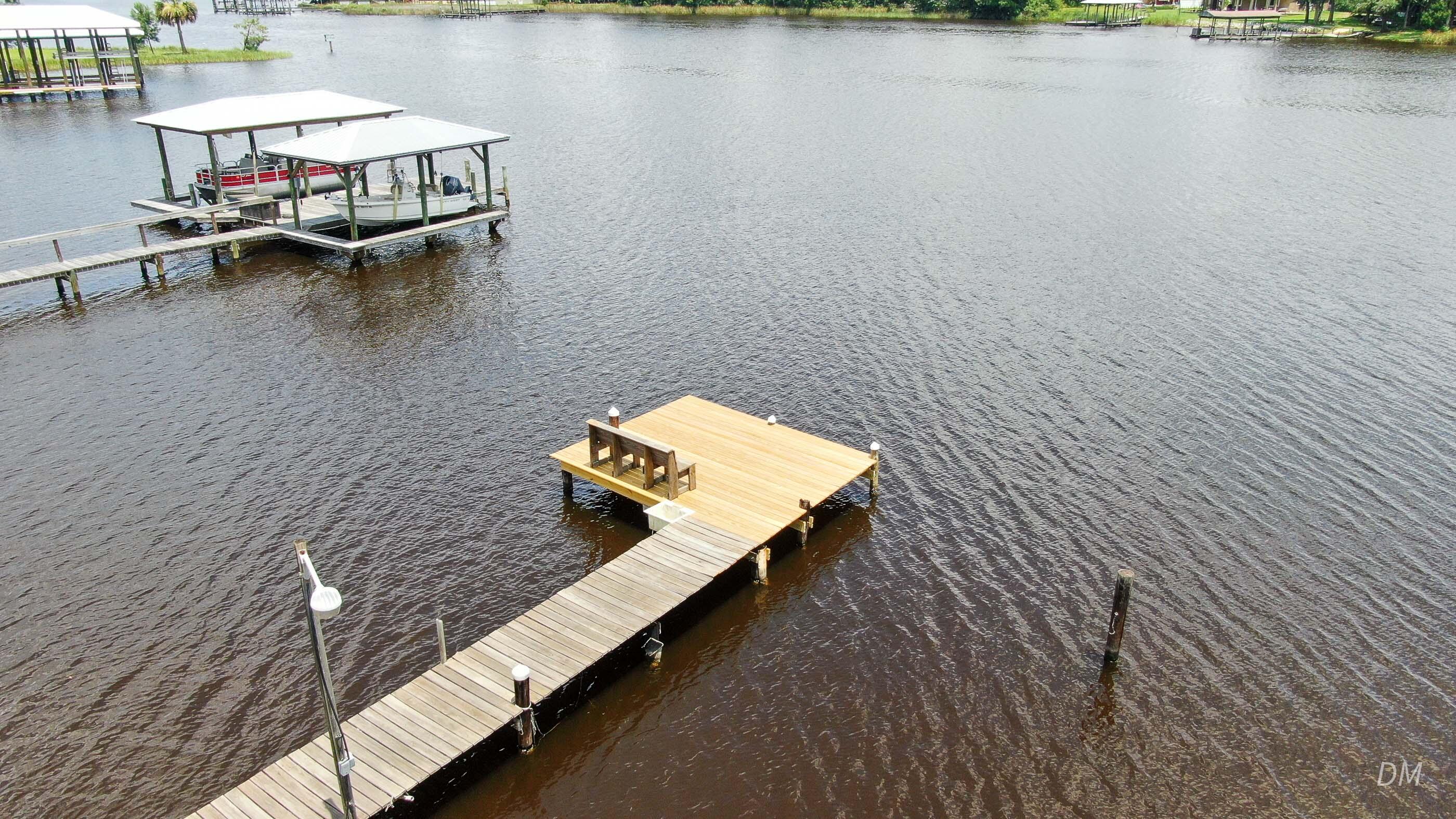 1124 Bay Grove Road Freeport, FL 32439 - Photo 37 of 37 a view of a lake with outdoor seating