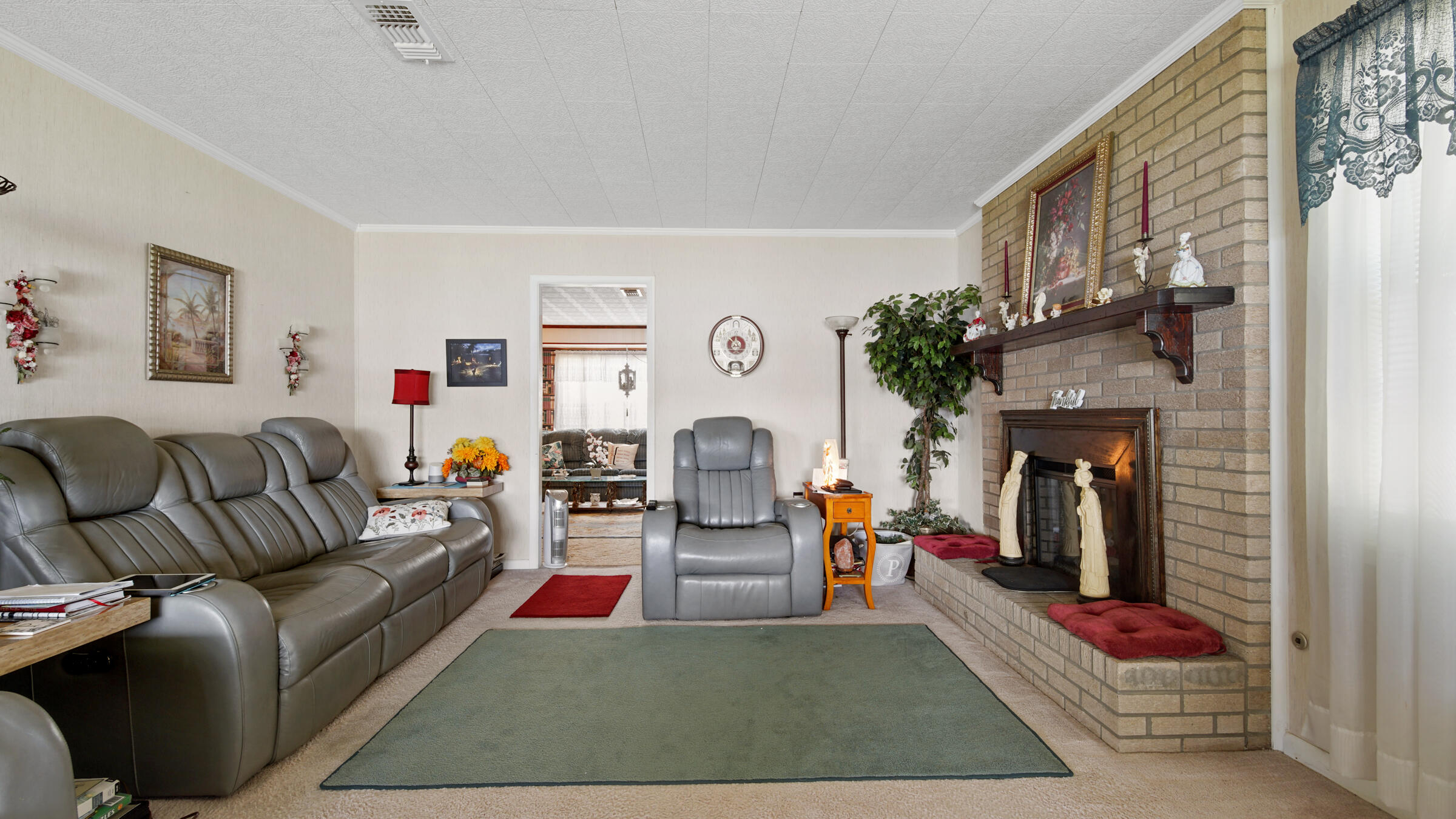 1124 Bay Grove Road Freeport, FL 32439 - Photo 7 of 37 a living room with fireplace furniture and a fireplace