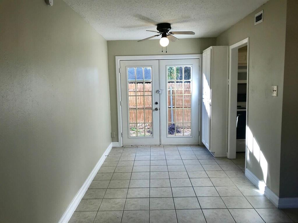 210 Austin Street Grapevine, TX 76051 - Photo 4 of 9 a view of an empty room with a window