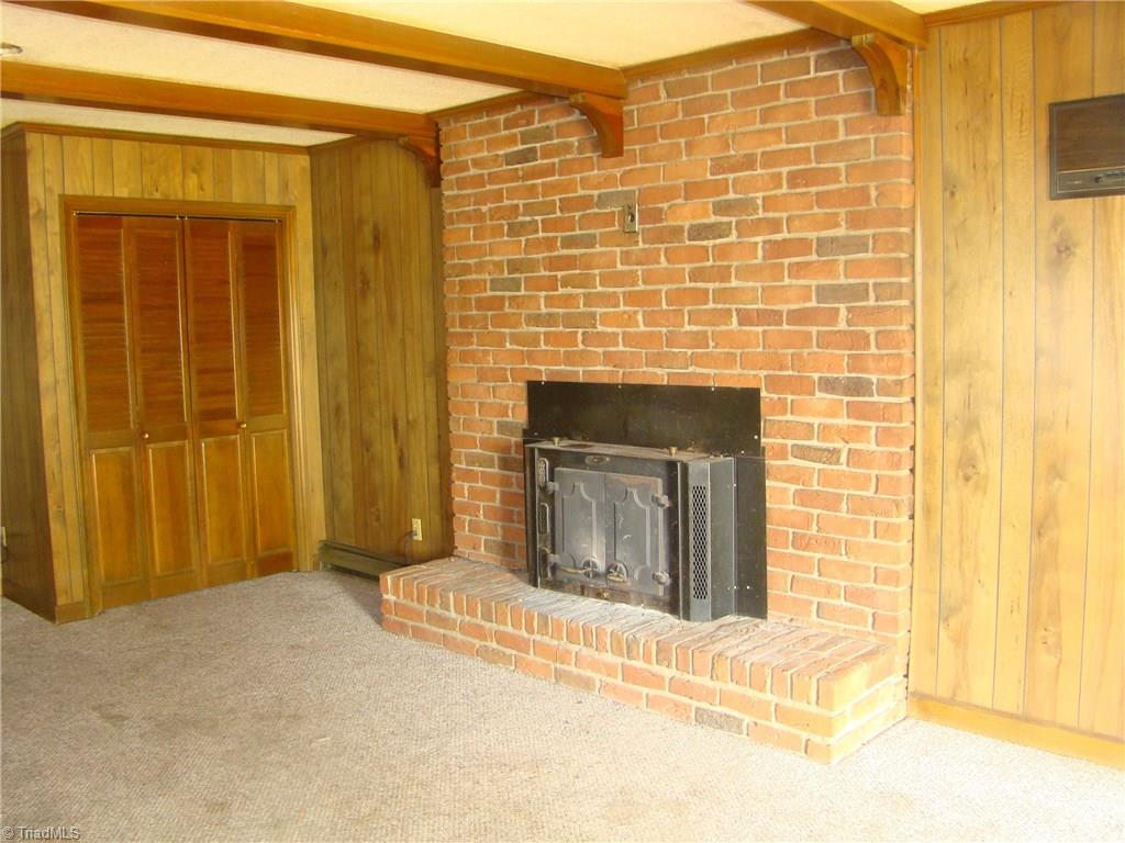 2904-2906 West English Road High Point, NC 27262 - Photo 3 of 17 Den with woodstove