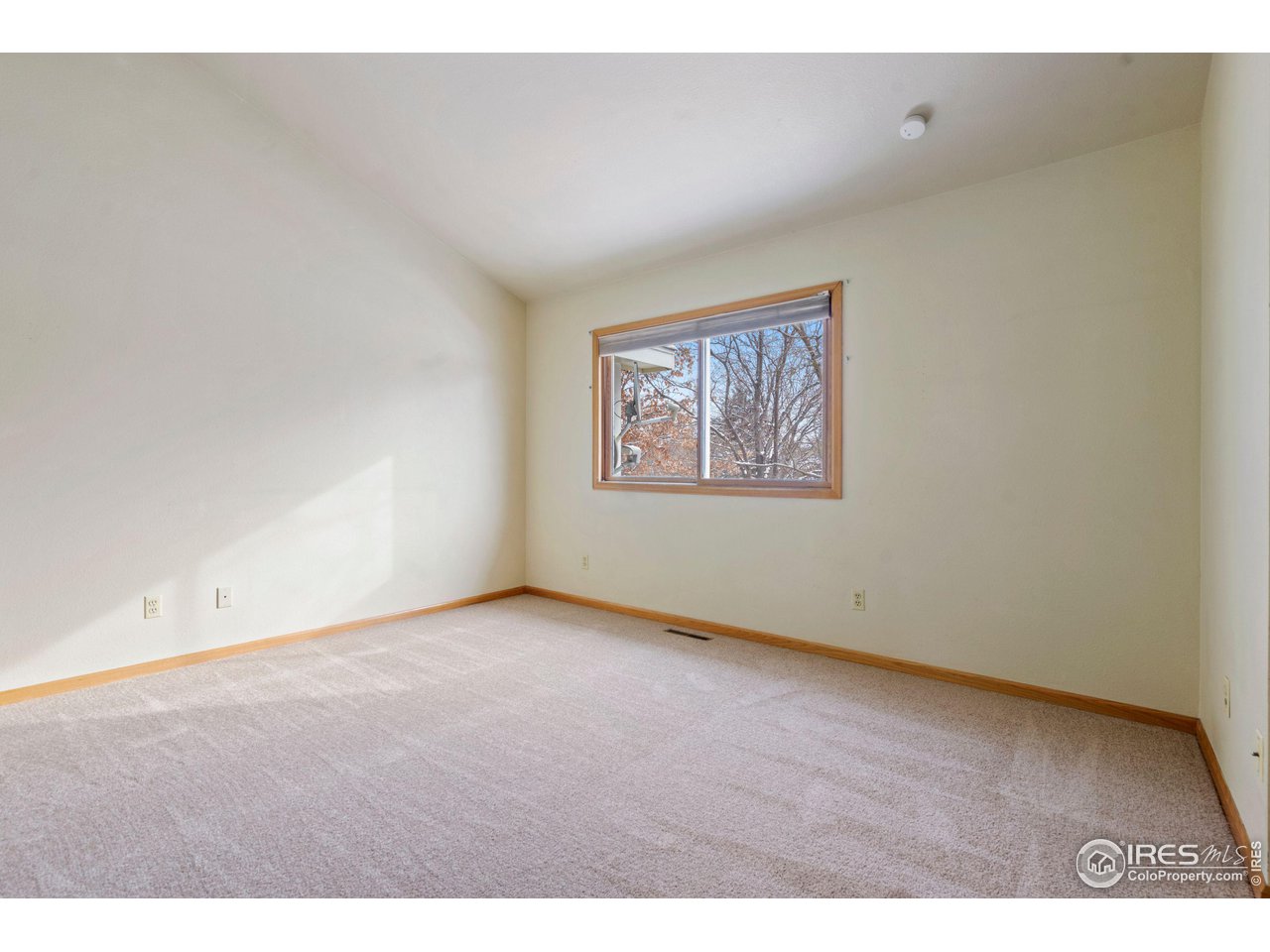 1074 Cunningham Drive, Unit 3 Fort Collins, CO 80526 - Photo 17 of 28 a view of an empty room with a window