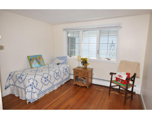 79 Levbert Road Newton, MA 02459 - Photo 14 of 21 a bedroom with a bed and wooden floor