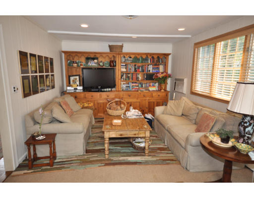 79 Levbert Road Newton, MA 02459 - Photo 4 of 21 a living room with furniture and a flat screen tv