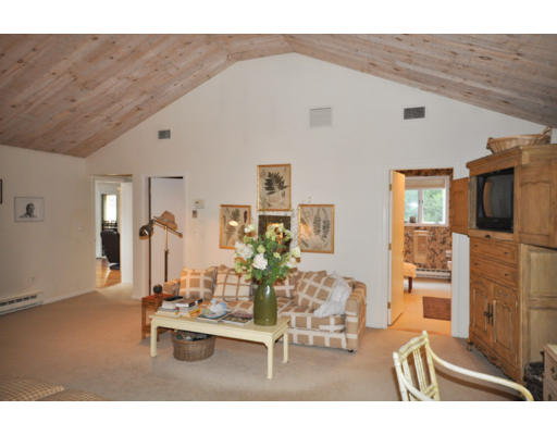 79 Levbert Road Newton, MA 02459 - Photo 9 of 21 a living room with furniture and flat screen tv