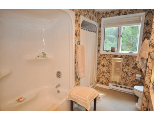 79 Levbert Road Newton, MA 02459 - Photo 10 of 21 a bathroom with a bathtub and shower