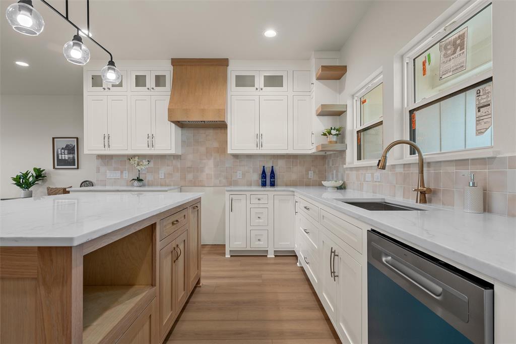 5200 Bogey Lane Waco, TX 76708 - Photo 13 of 37 a kitchen with granite countertop a sink stove and cabinets