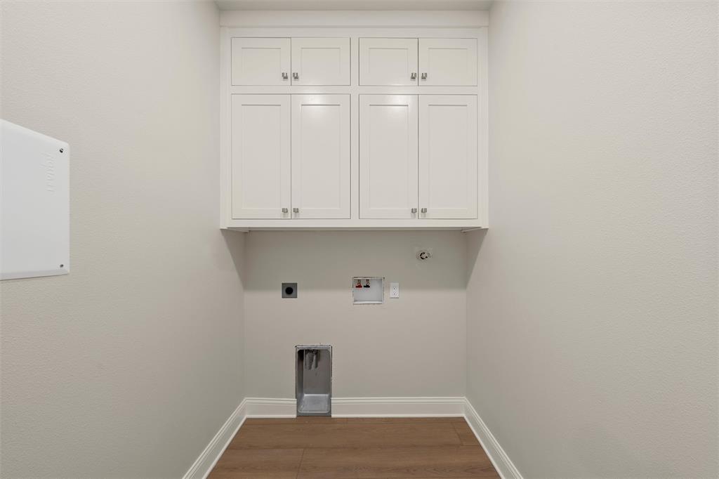 5200 Bogey Lane Waco, TX 76708 - Photo 17 of 37 a view of storage and utility room with wooden floor