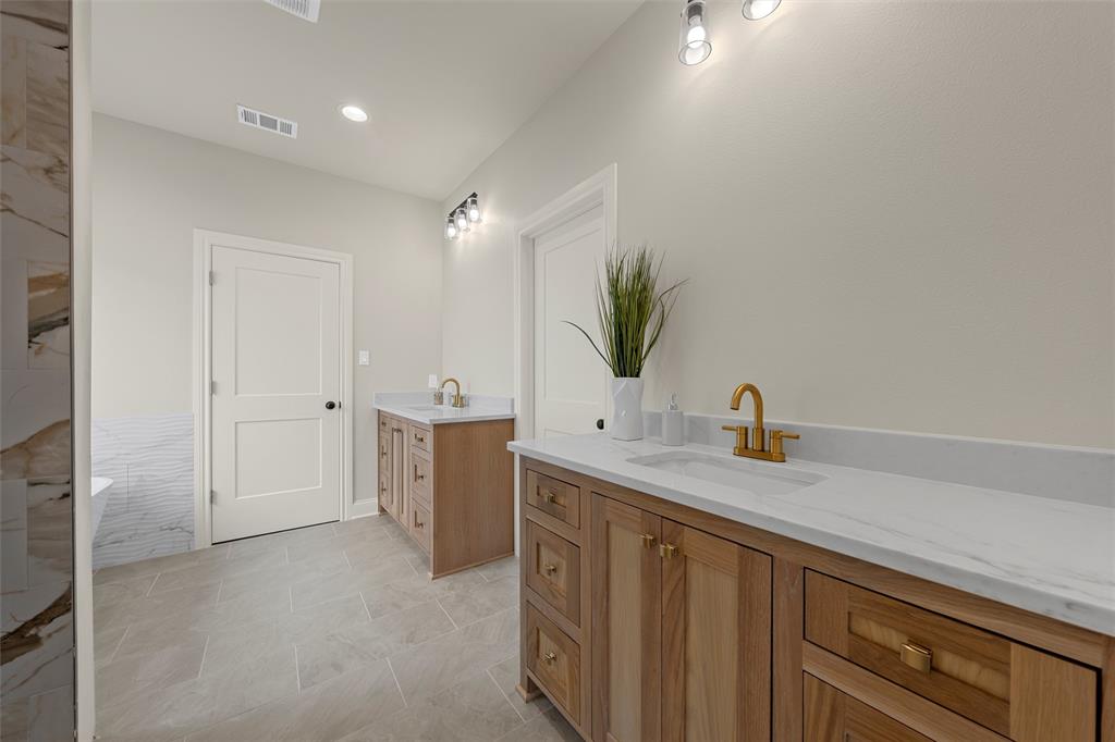 5200 Bogey Lane Waco, TX 76708 - Photo 24 of 37 a bathroom with a sink and a mirror