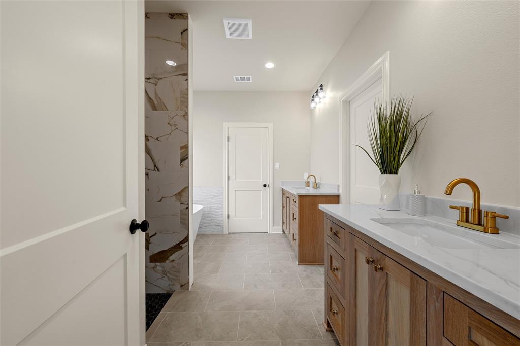 5200 Bogey Lane Waco, TX 76708 - Photo 25 of 37 a kitchen with a sink and a refrigerator