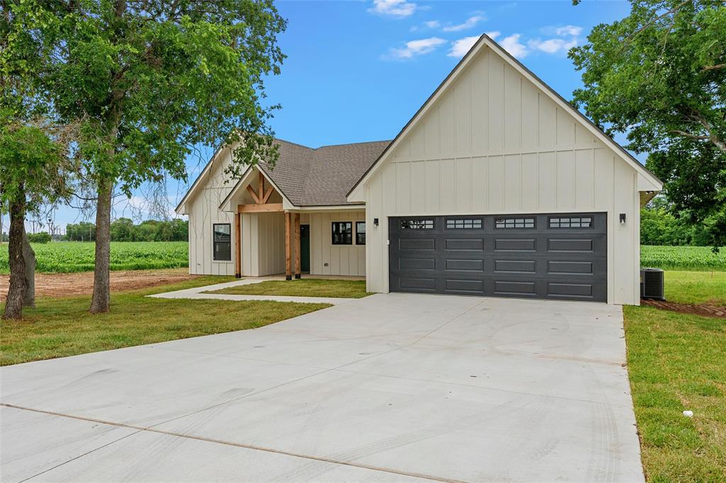 5200 Bogey Lane Waco, TX 76708 - Photo 3 of 37 a front view of a house with a yard and garage