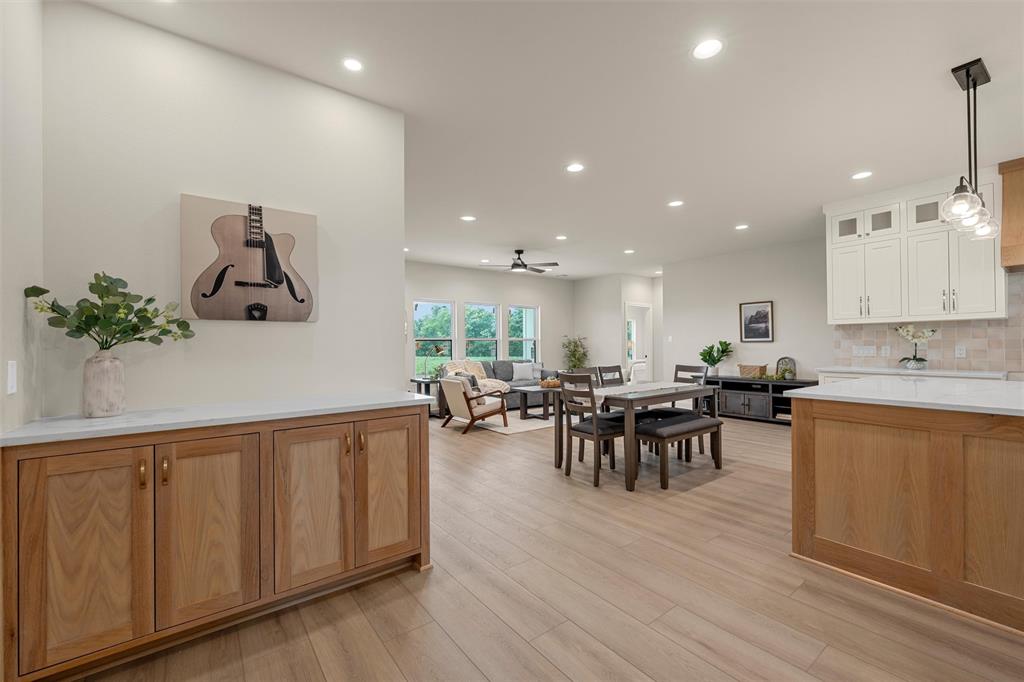 5200 Bogey Lane Waco, TX 76708 - Photo 5 of 37 a view of a dining room with furniture chandelier and wooden floor