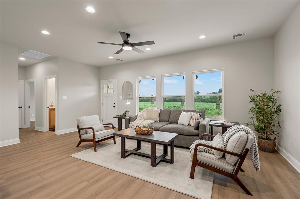 5200 Bogey Lane Waco, TX 76708 - Photo 6 of 37 a living room with furniture and a large window